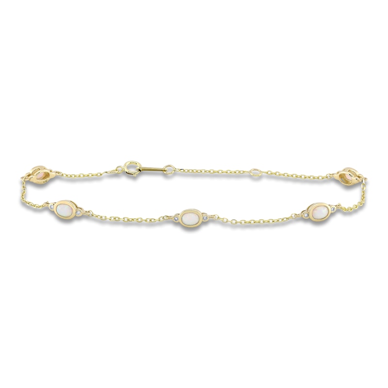 Main Image 1 of Oval-Cut Lab-Created Opal & Diamond Station Bracelet 1/20 ct tw 10K Yellow Gold 7.25"
