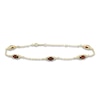 Thumbnail Image 1 of Oval-Cut Natural Garnet & Diamond Station Bracelet 1/15 ct tw 10K Yellow Gold 7.25"