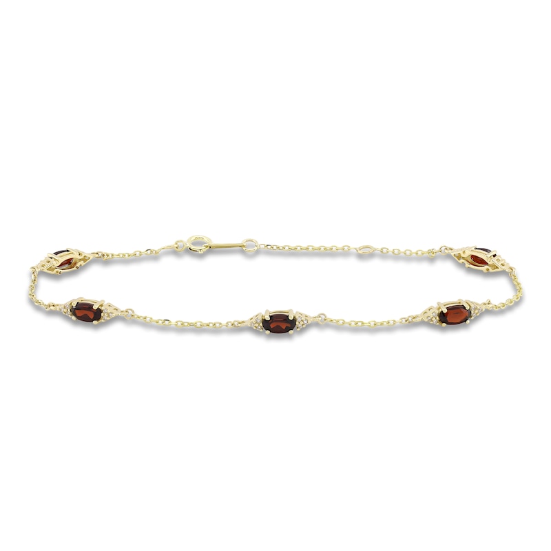Main Image 1 of Oval-Cut Natural Garnet & Diamond Station Bracelet 1/15 ct tw 10K Yellow Gold 7.25"