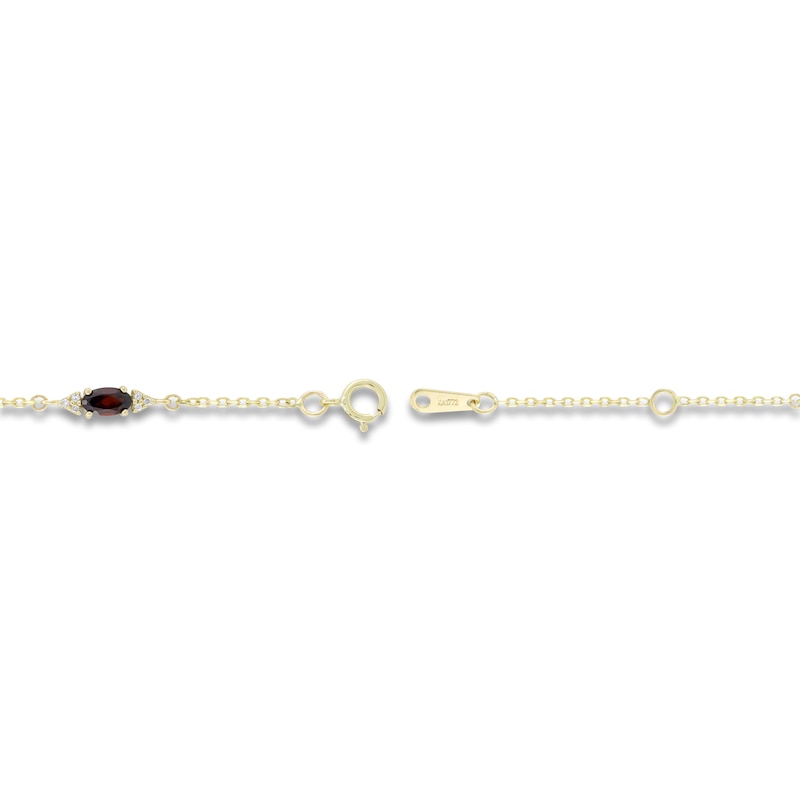 Main Image 2 of Oval-Cut Natural Garnet & Diamond Station Bracelet 1/15 ct tw 10K Yellow Gold 7.25"